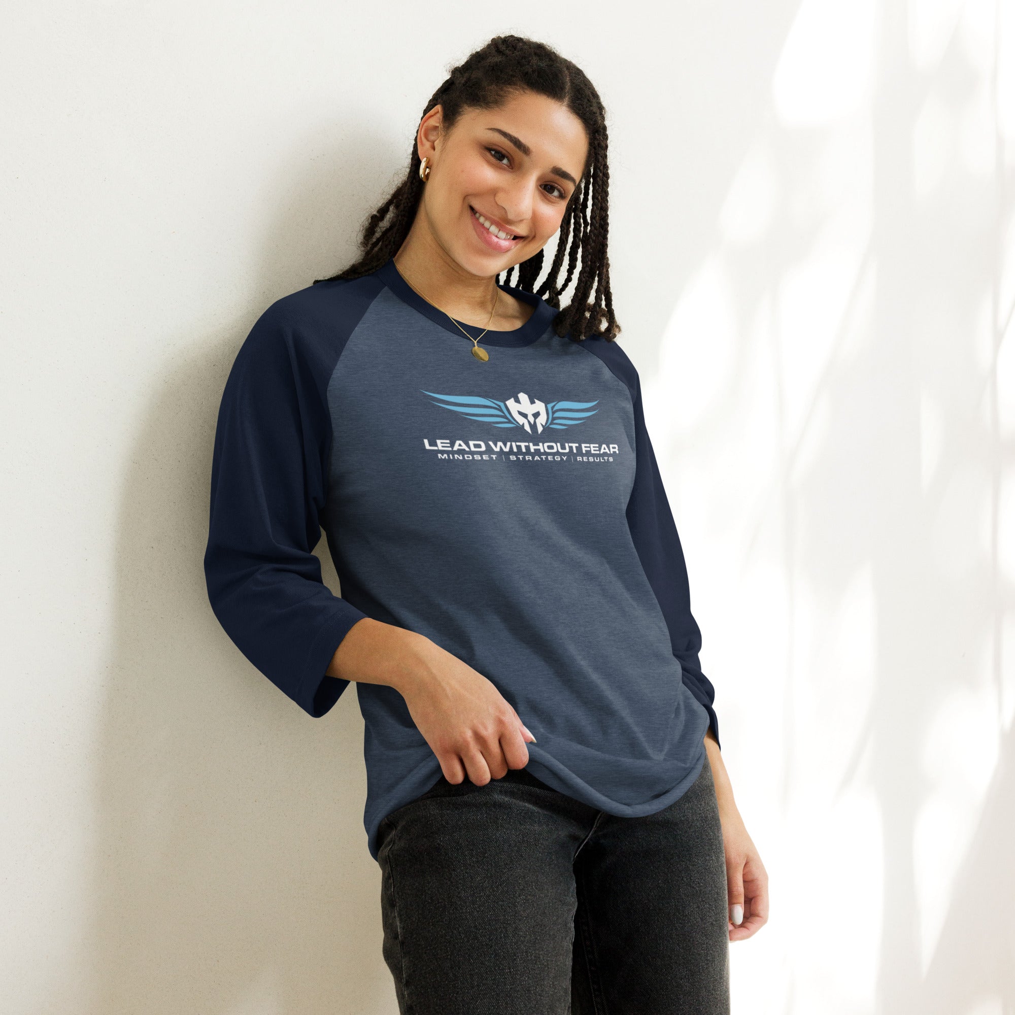 Lead Without Fear three-quarter sleeve baseball tee, black and white raglan style, helmet and wings chest logo.