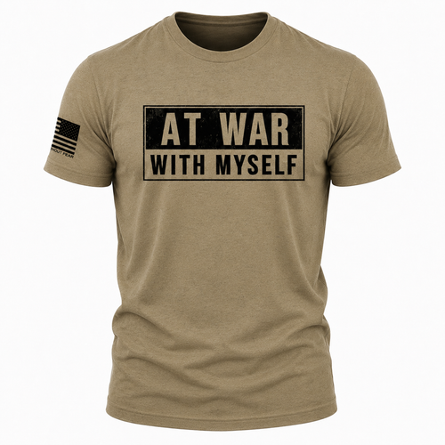 A short-sleeve crewneck t-shirt in heathered tan/khaki, featuring a distressed black graphic on the chest that reads 'AT WAR WITH MYSELF' in beige block letters. A black American flag graphic is printed on the right sleeve.