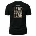 A black short-sleeve t-shirt shown from the back, featuring a distressed beige graphic print that reads 'LEAD WITHOUT FEAR' with 'COURAGE OVER COMFORT' underneath and a winged emblem above.