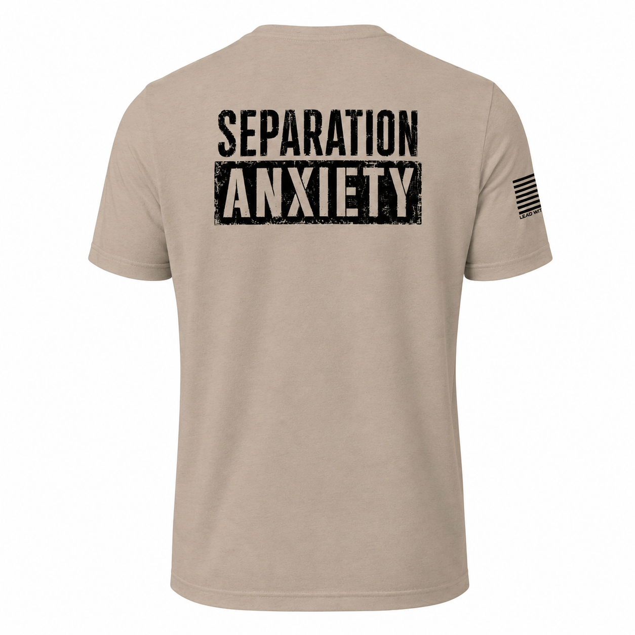 A light tan short-sleeve t-shirt shown from the back, featuring the words 'SEPARATION ANXIETY' printed in a distressed black block font across the upper back. A small black American flag graphic is printed on the left sleeve.