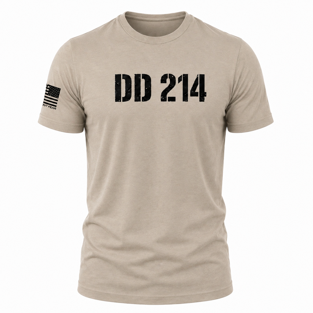 A short-sleeve crewneck t-shirt in a light tan/beige color, featuring the distressed black text 'DD 214' across the chest and a black American flag graphic on the right sleeve, shown on a plain white background.