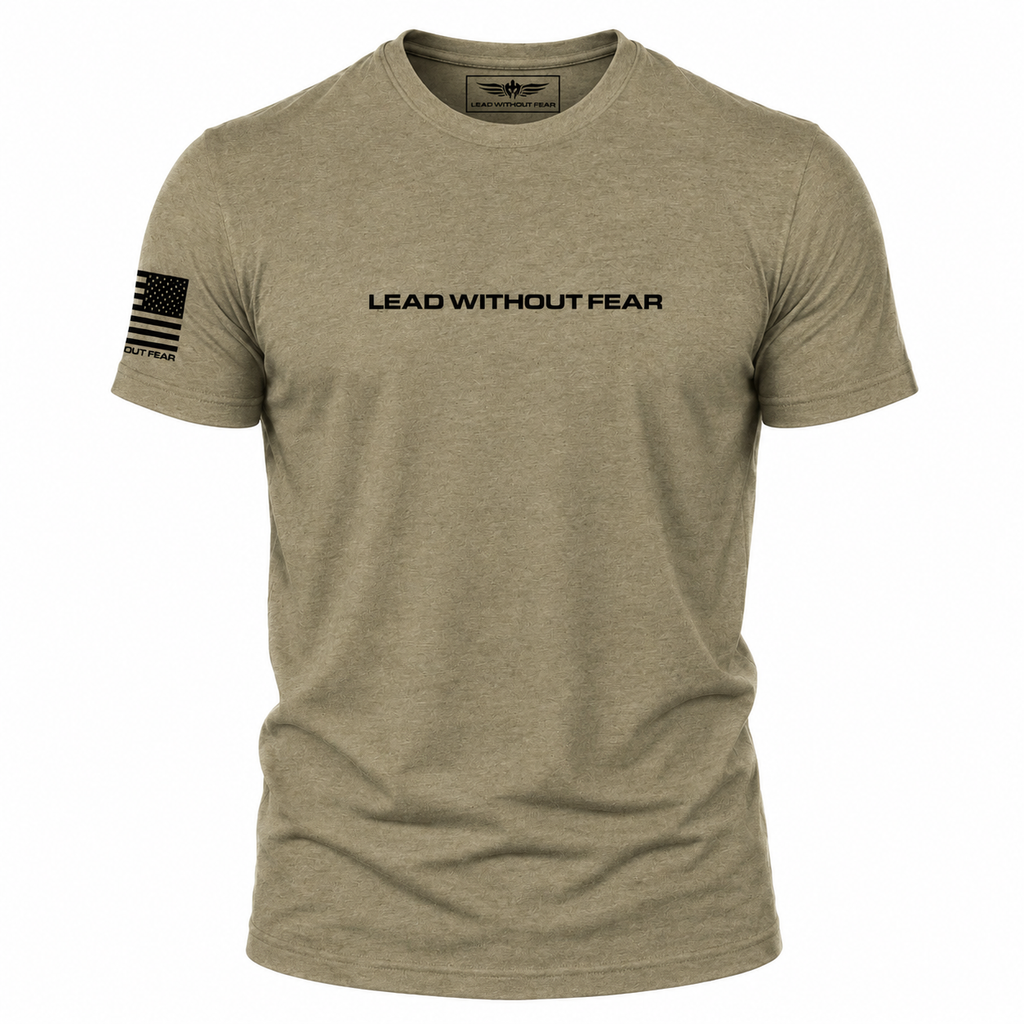 A heathered khaki short-sleeve t-shirt with 'LEAD WITHOUT FEAR' printed in black across the chest and a black American flag graphic on the right sleeve, shown on a plain white background.