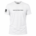 A white short-sleeve crewneck t-shirt with 'LEAD WITHOUT FEAR' printed in black across the chest and a black American flag graphic on the right sleeve, shown on a plain white background.