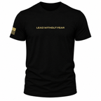 A black short-sleeve crewneck t-shirt with 'LEAD WITHOUT FEAR' printed in gold across the chest and a gold American flag graphic on the right sleeve, shown on a plain white background.