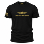 A black short-sleeve crewneck t-shirt with a gold winged logo and the text 'LEAD WITHOUT FEAR' printed on the chest, featuring a gold American flag graphic on the right sleeve.