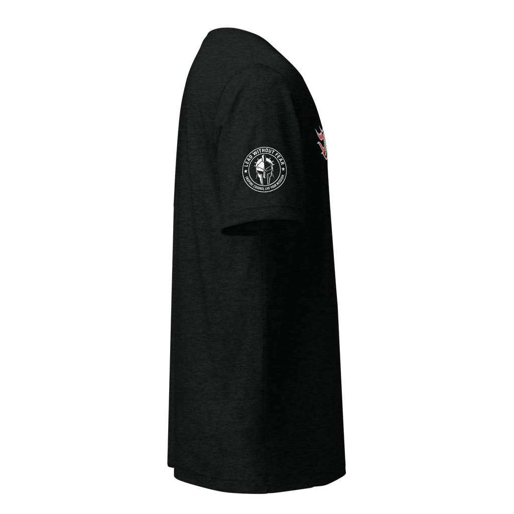 A black short-sleeve t-shirt shown from the side profile against a solid white background. The shirt features a circular white and black graphic on the left sleeve depicting a Spartan helmet and the text 'UNITED STATES MARINES', with a small red and white graphic on the right sleeve.