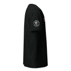 A black short-sleeve t-shirt shown from the side profile against a solid white background. The shirt features a circular white and black graphic on the left sleeve depicting a Spartan helmet and the text 'UNITED STATES MARINES', with a small red and white graphic on the right sleeve.