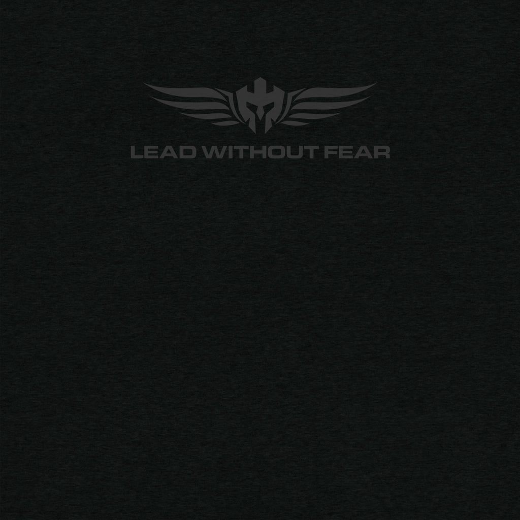 Close up of Lead Without Fear logo black shirt and black helmet with wings and LEAD WITHOUT FEAR underneath it. 