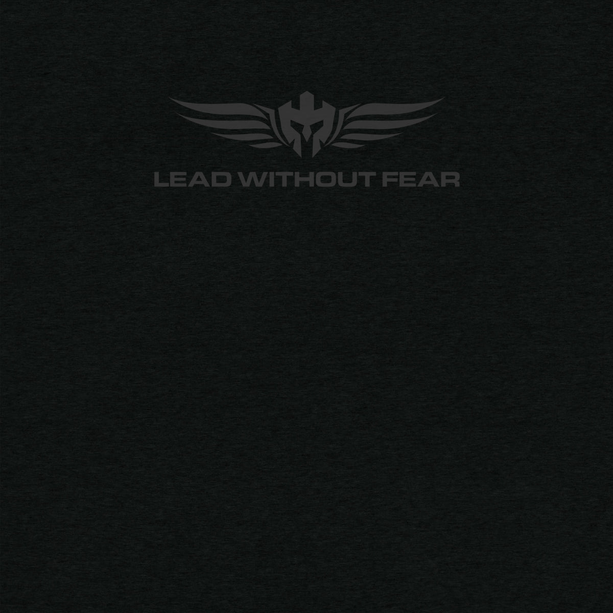 Close up of Lead Without Fear logo black shirt and black helmet with wings and LEAD WITHOUT FEAR underneath it. 