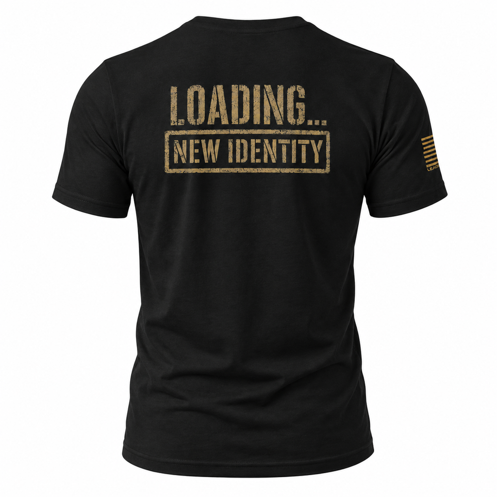 Black short-sleeve t-shirt shown from the back, featuring a distressed gold print that reads 'LOADING...NEW IDENTITY'.