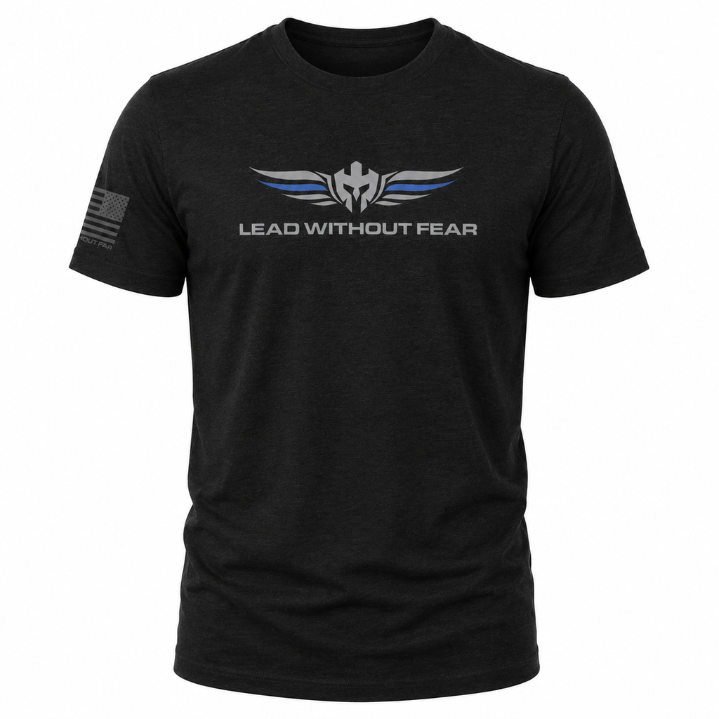 A black short-sleeve t-shirt with a 'LEAD WITHOUT FEAR' graphic on the chest featuring a silver winged emblem with blue accents and a distressed American flag on the right sleeve, shown on a plain white background.