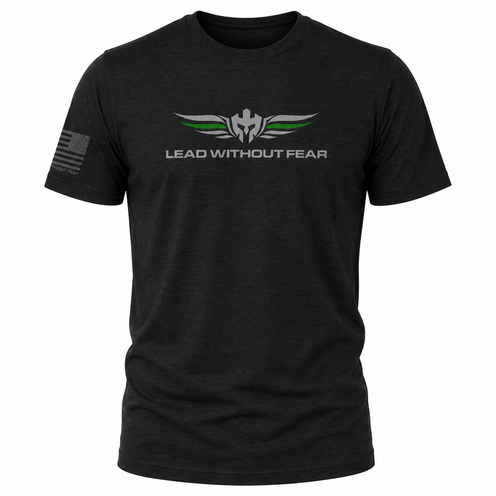 A black short-sleeve t-shirt with a 'LEAD WITHOUT FEAR' graphic on the chest featuring a winged emblem with green and white accents, and a distressed American flag on the right sleeve.