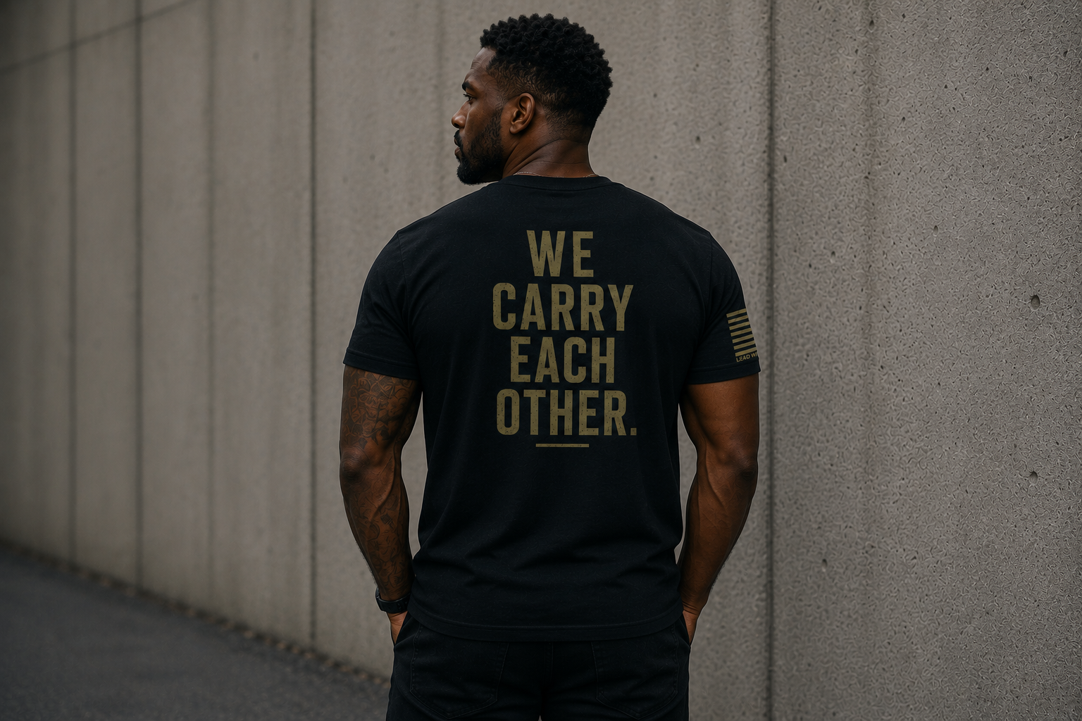 Veteran We Carry Each Other Back military tee shirt with male model.