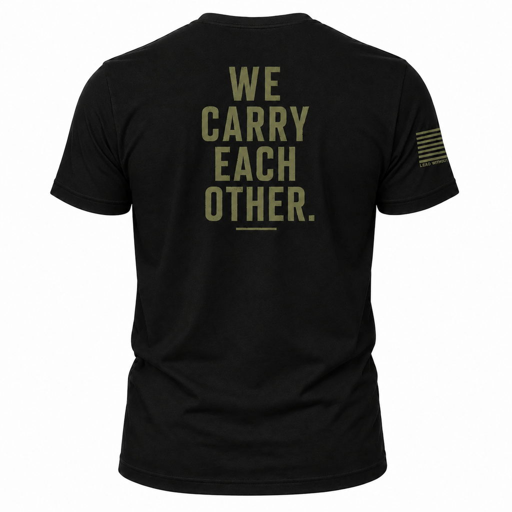 Black military style shirt with olive green graphic saying We Carry Each Other. An American Flag is on the sleeve. Patriotic Veteran Shirt.