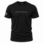 A black short-sleeve crewneck t-shirt with 'LEAD WITHOUT FEAR' printed in white across the chest and a small American flag graphic on the right sleeve, shown on a plain white background.