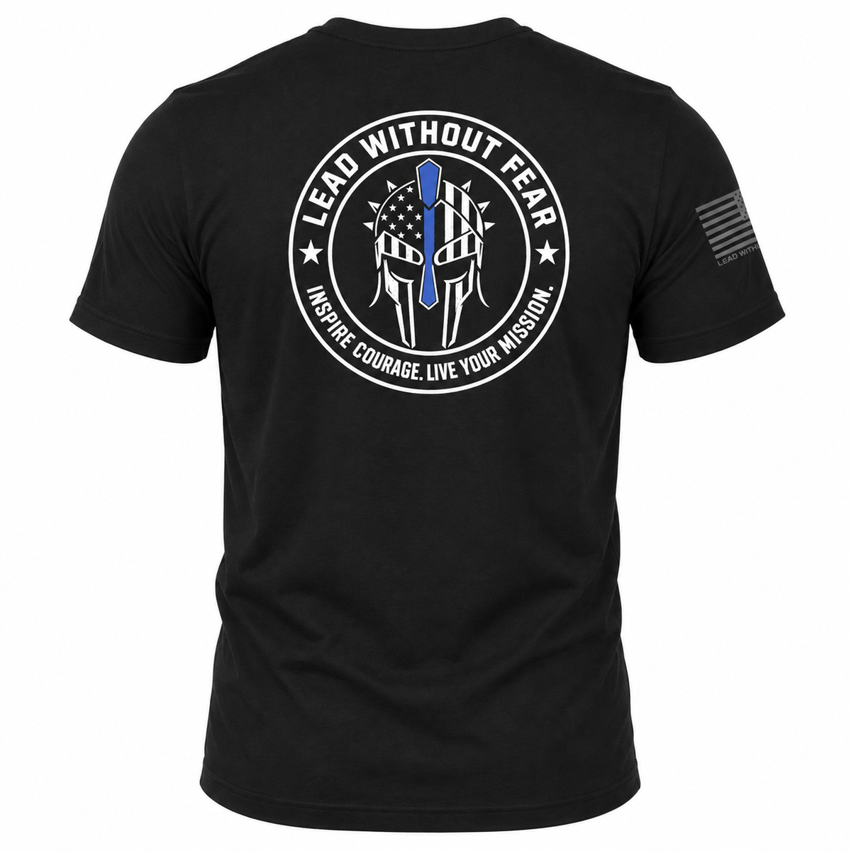 Black short-sleeve t-shirt shown from the back, featuring a large circular white graphic with a blue line-art element and the text 'LEAD WITHOUT FEAR' and 'INSPIRE COURAGE LIVE YOUR MISSION.' A smaller black flag-style print appears on the left sleeve.